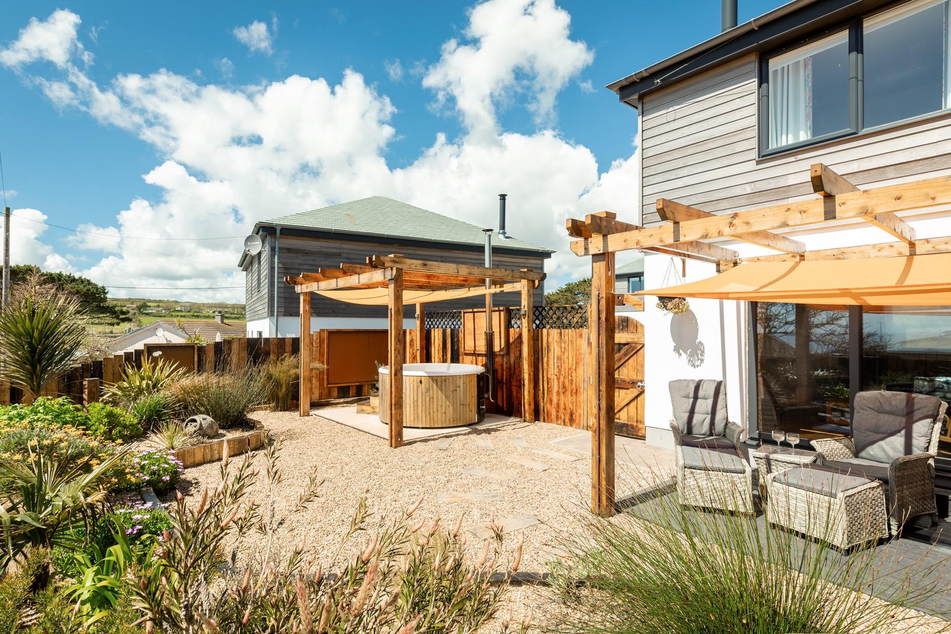 The garden is blooming with beautiful plants and flowers.