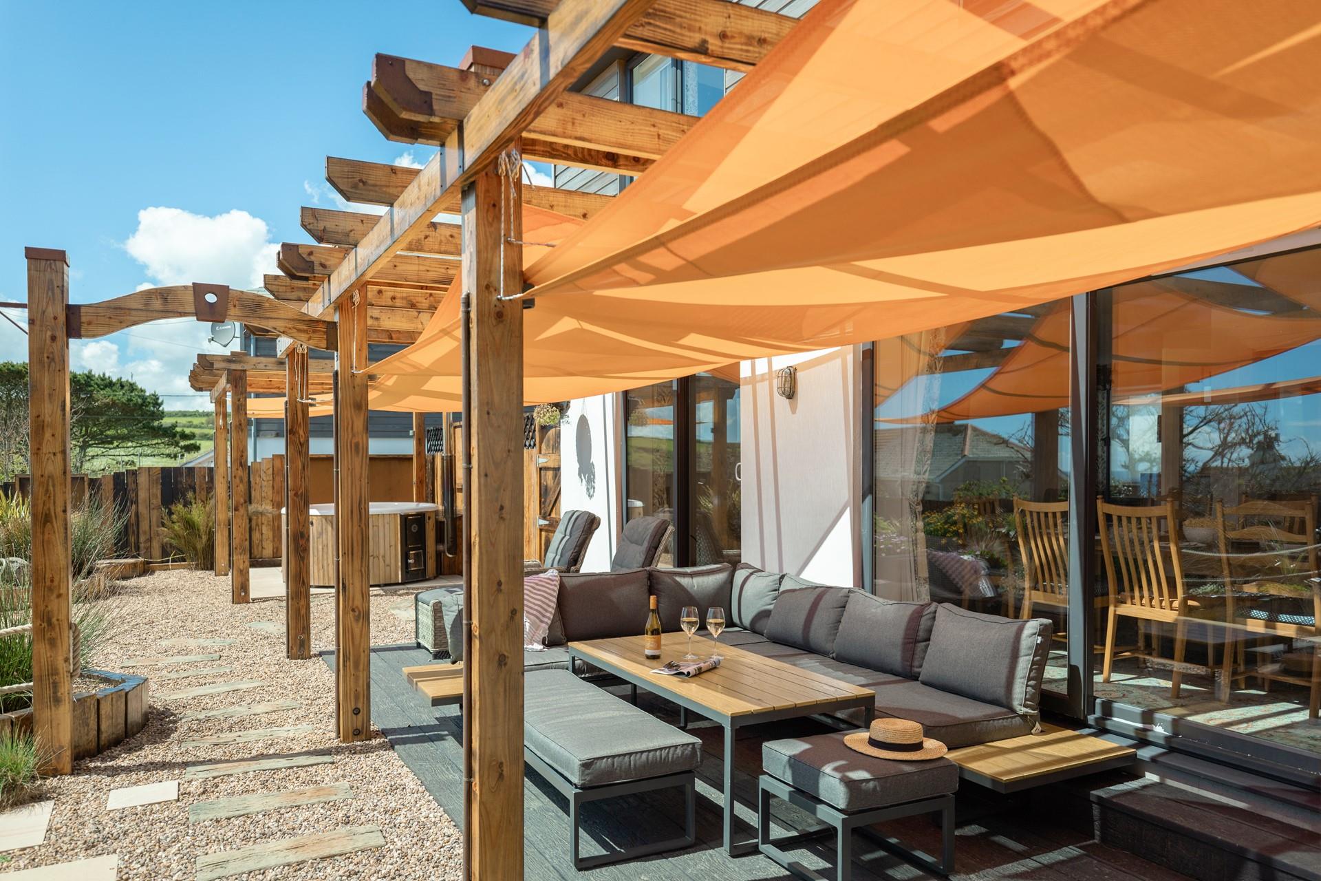 Dine al fresco in the summer sunshine in the beautifully landscaped garden.