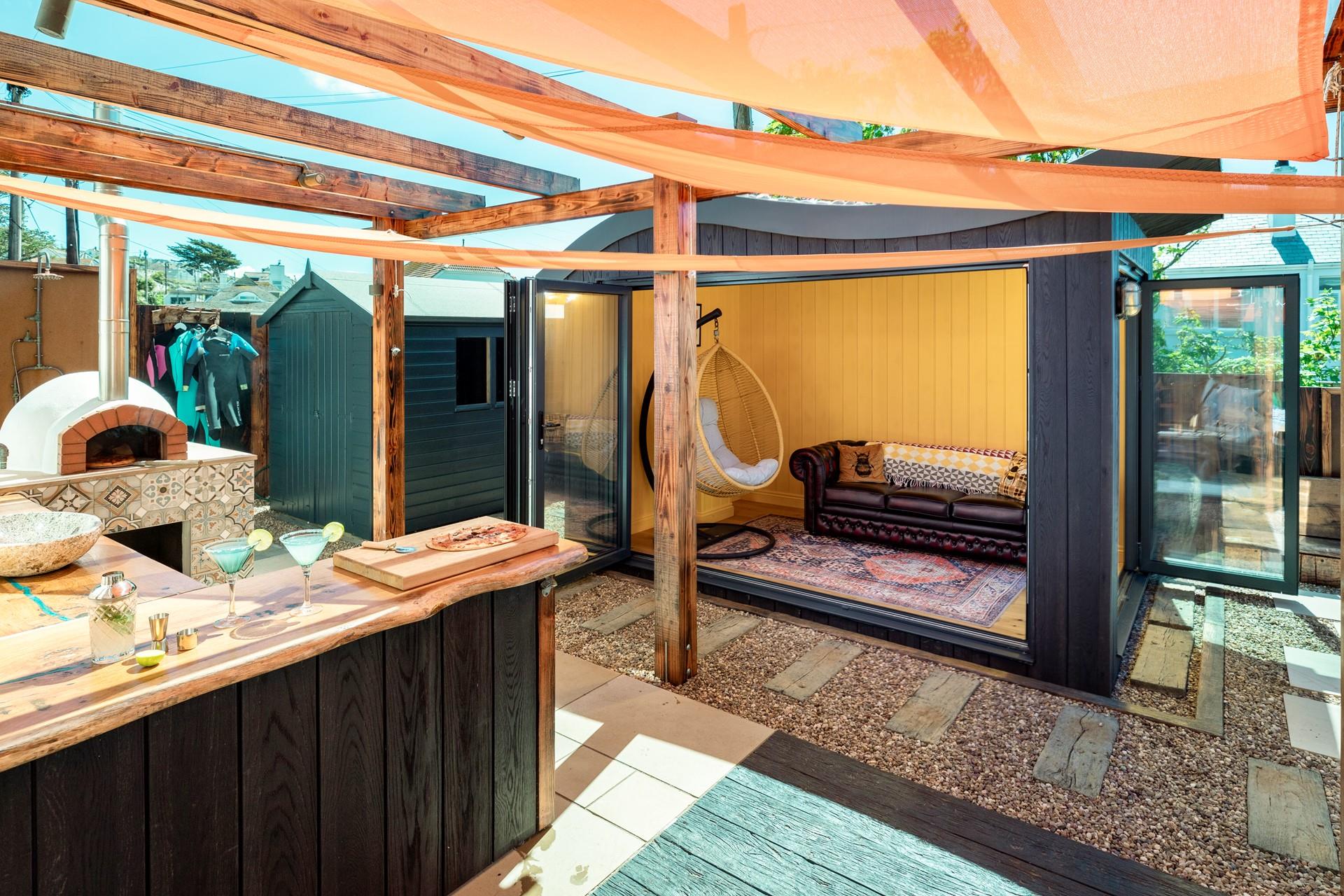 The garden room provides space to enjoy the outside area whilst seeking some shade.