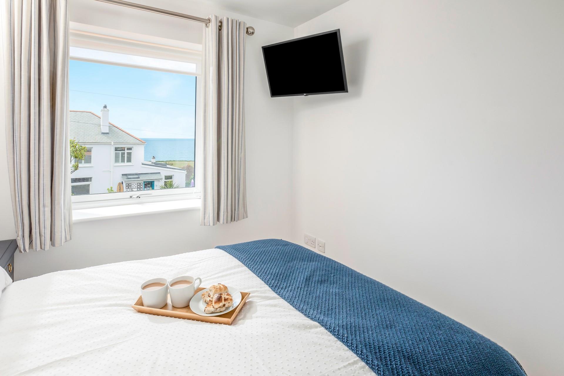 Open the curtains and enjoy the sea glistening from the window while sipping a cuppa.