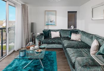 There's plenty of space on the sumptuous sofa for all the family to relax.