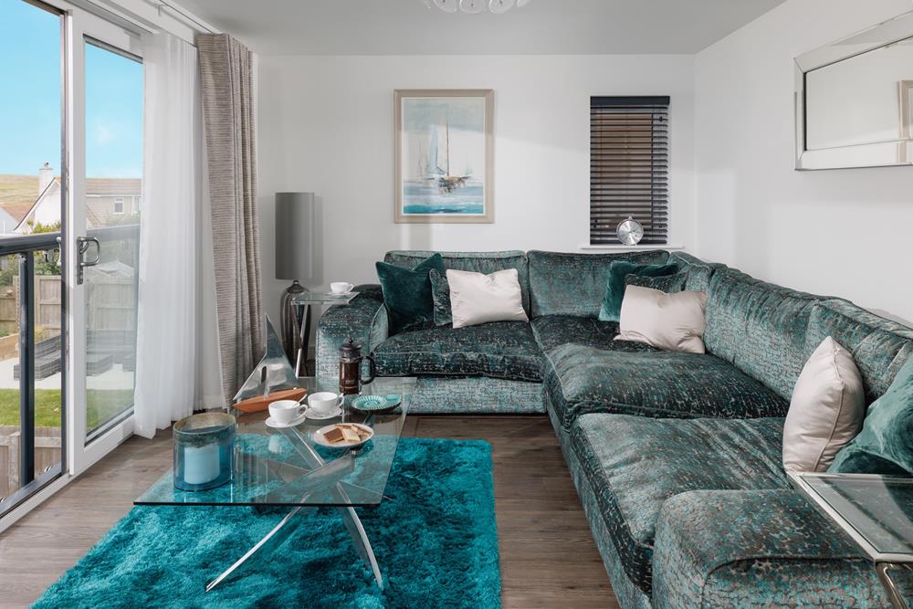 There's plenty of space on the sumptuous sofa for all the family to relax.