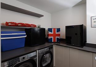 The utility has the added luxury of a beer and wine fridge!