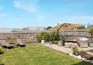 The garden boasts several serene seating areas.