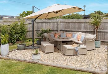 Unwind in the stylish garden with a chilled glass in hand.