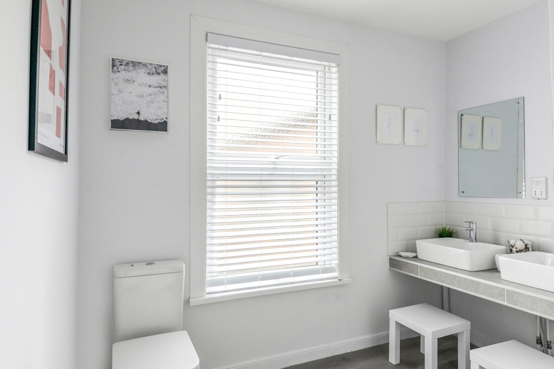 Get ready for the day in the spacious bathroom.