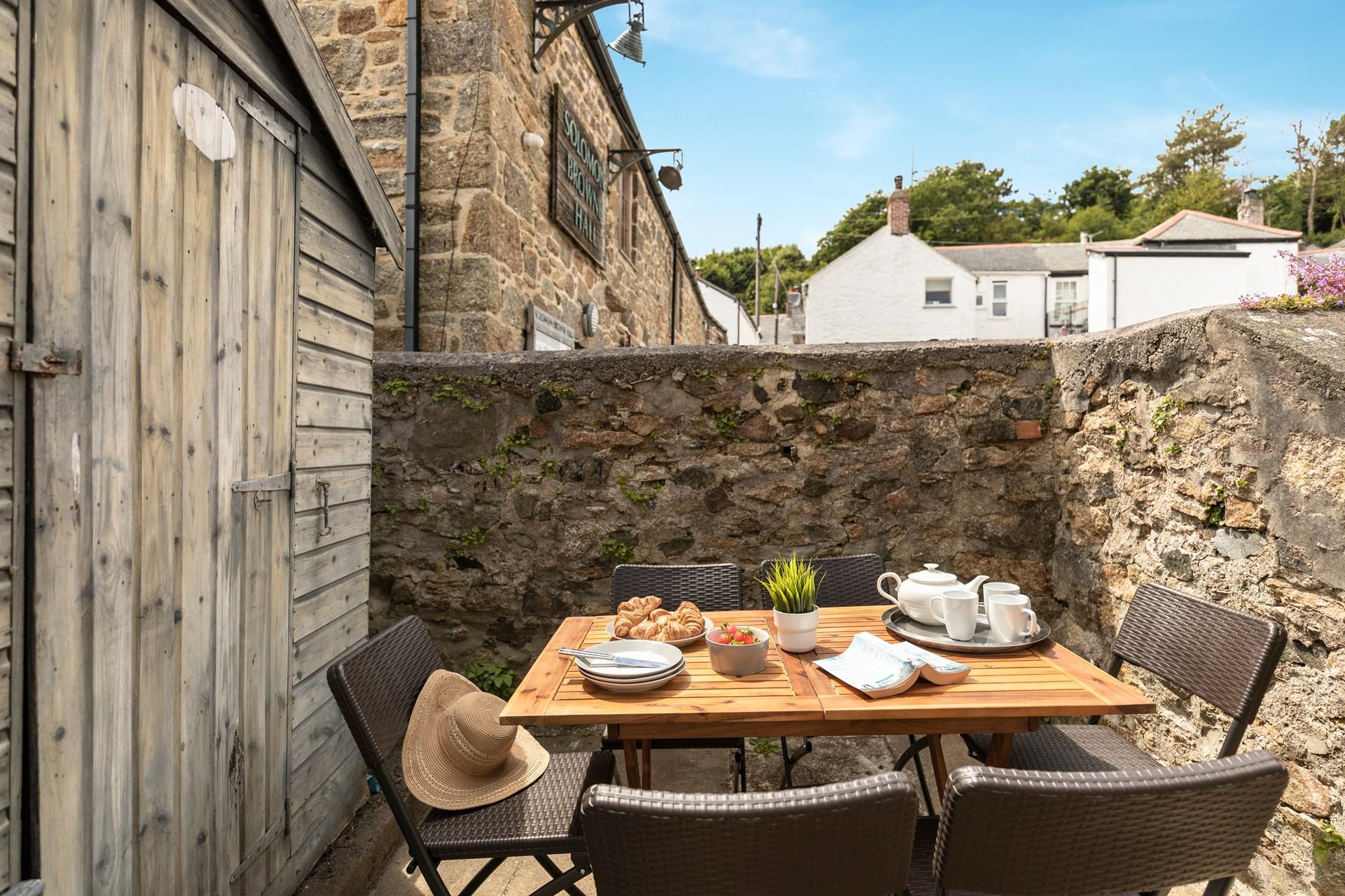 Start the day with fresh pastries in the summer sunshine.