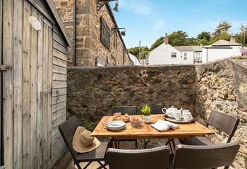 Start the day with fresh pastries in the summer sunshine.