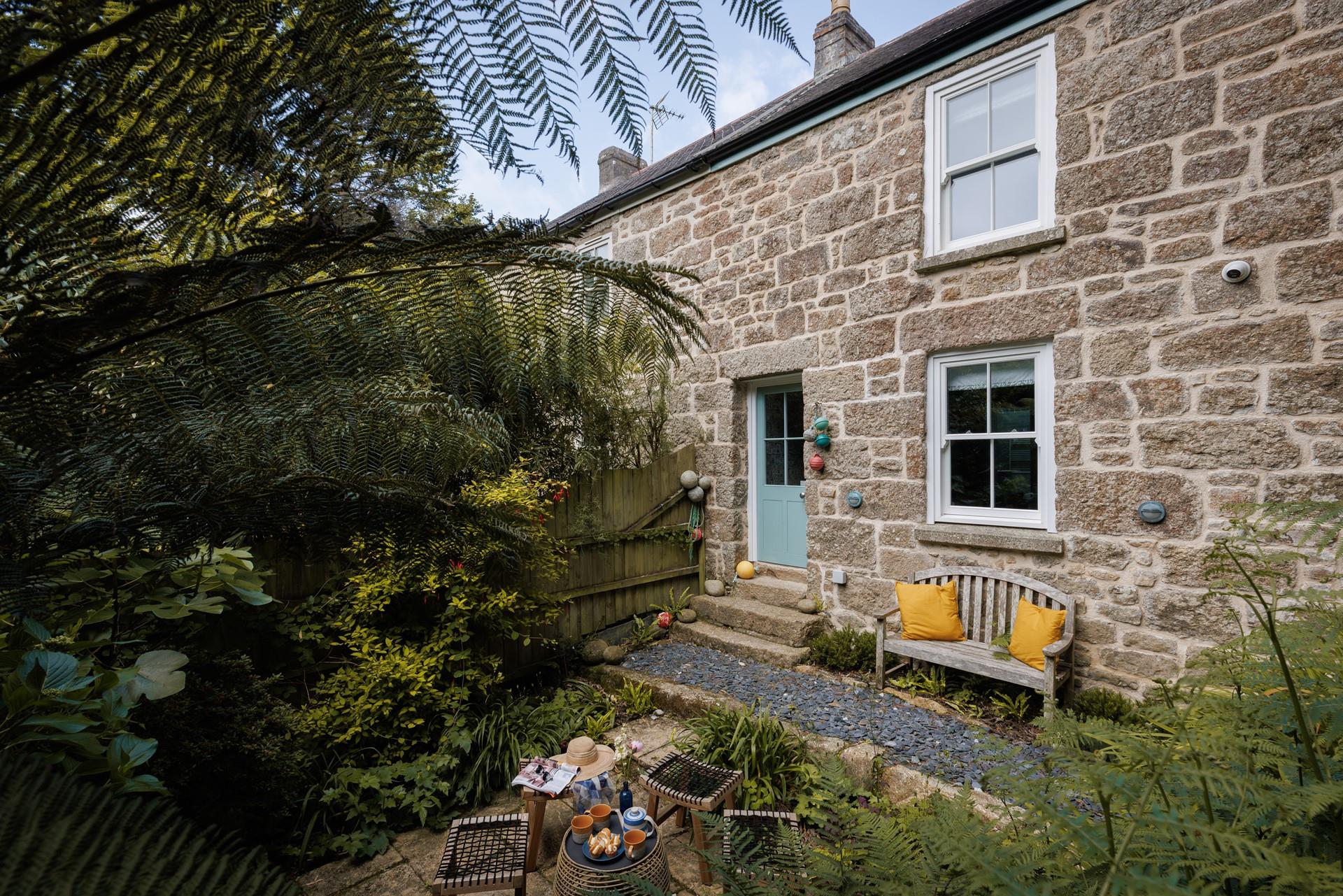 Lush sub-tropical plants make a peaceful oasis.