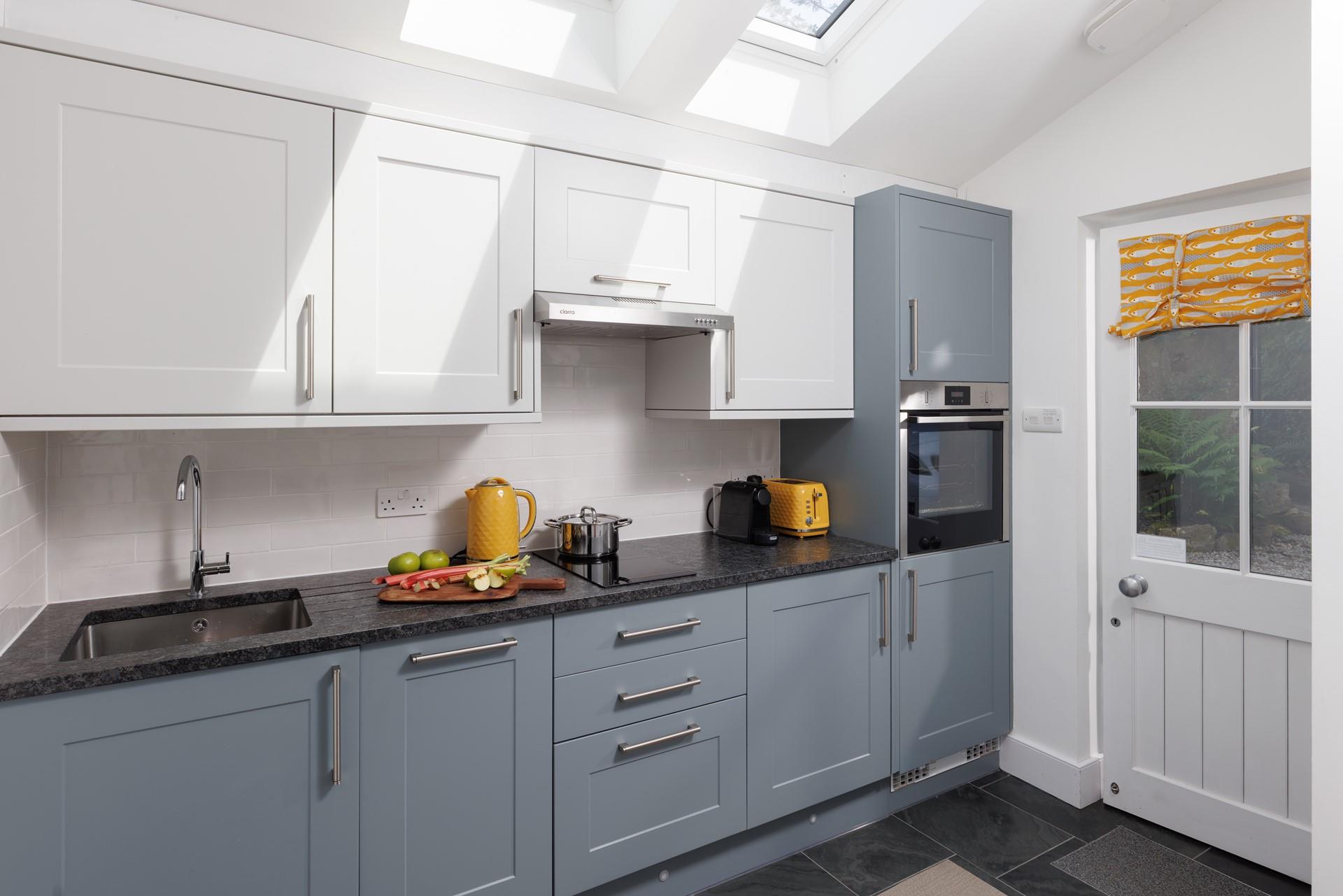 The modern kitchen has all you need for a relaxing stay with family or friends.