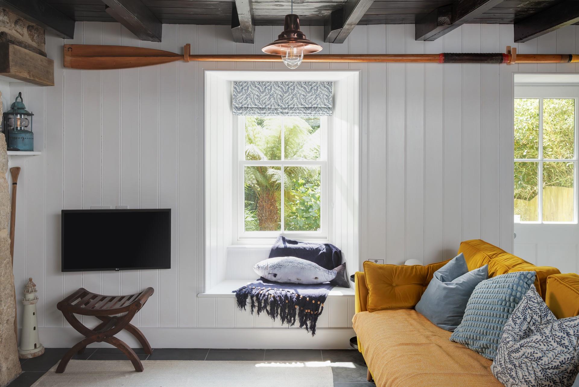 Enjoy the view of the pretty tropical-style garden from the window seat.