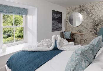 The stylish feature wall shows a map of Mousehole.