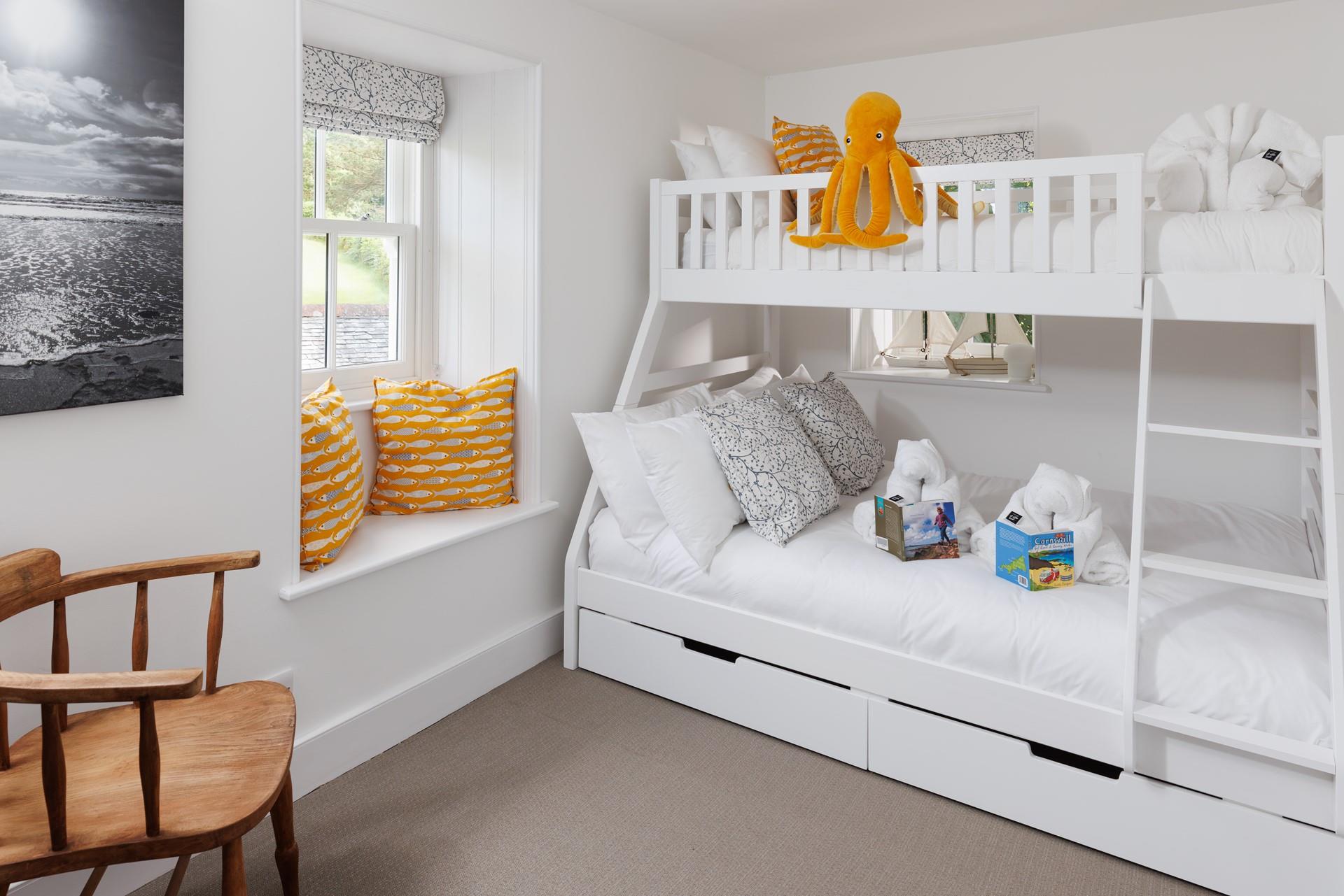 Children will love the bright and cheerful bunk bedroom.
