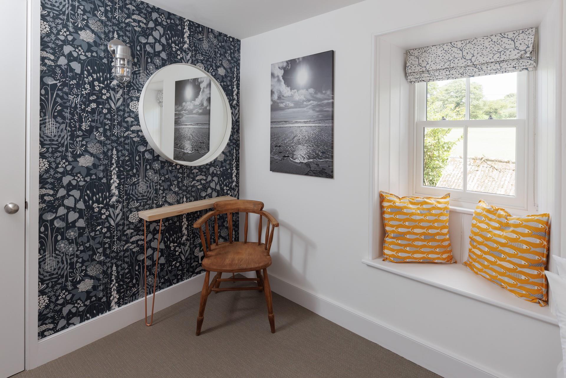 A quaint window seat with views across the Cornish countryside