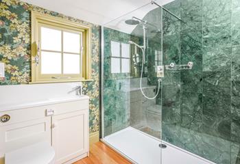 Wash off sandy toes in the rainfall shower after a day on the beach.