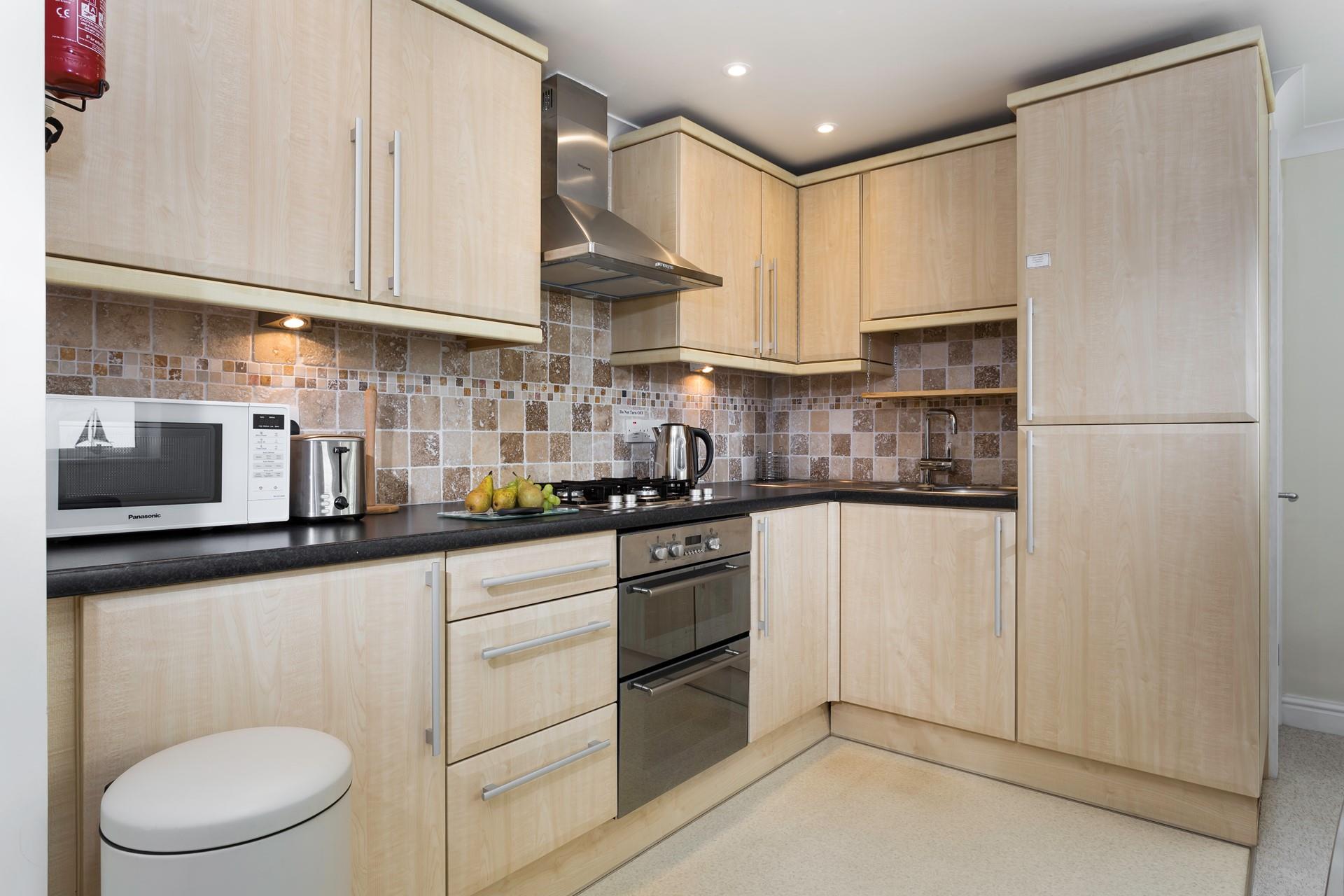 The kitchen is fully equipped for cooking tasty meals.