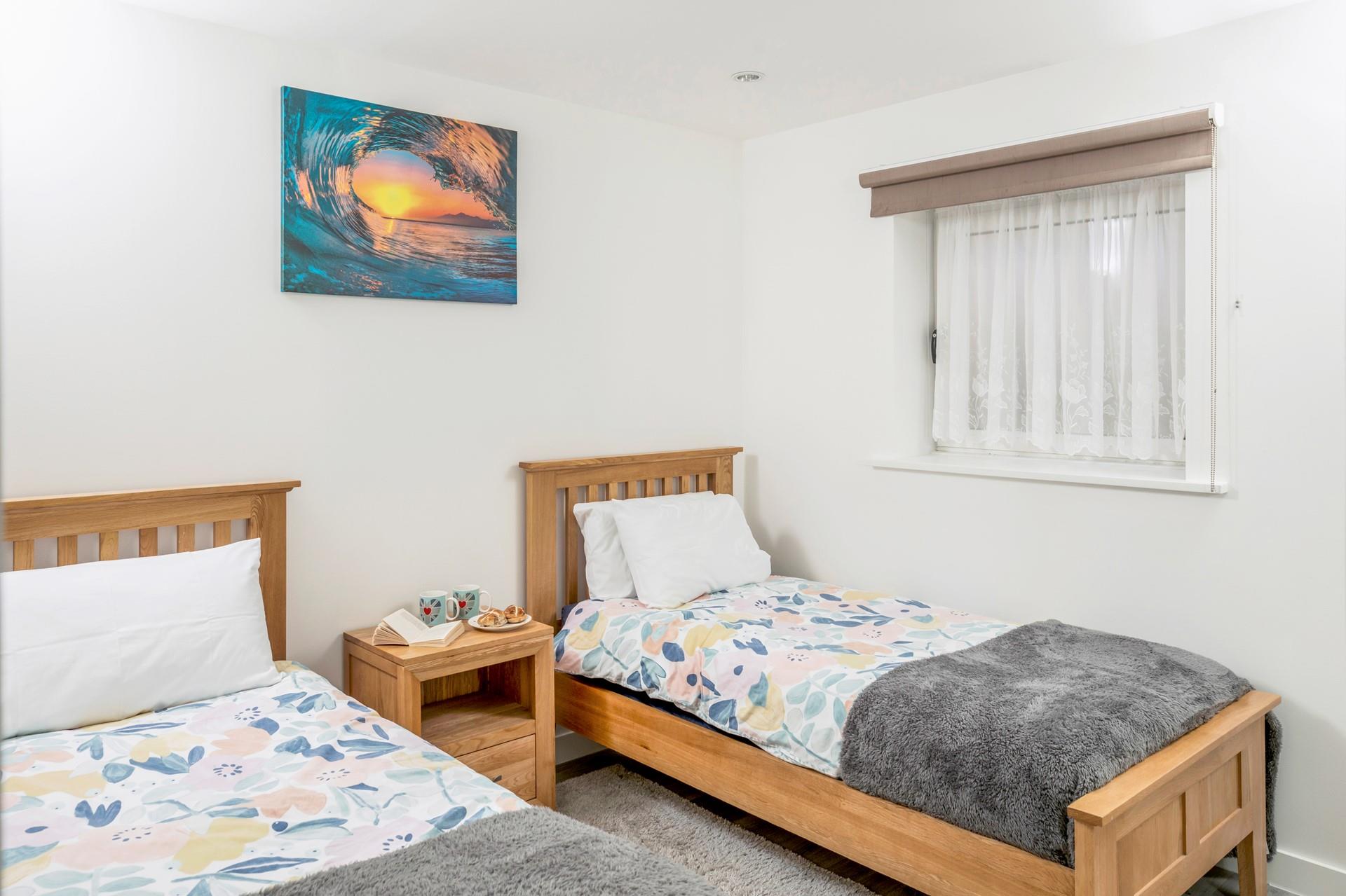 Bedroom 2 has twin beds offering a relaxing night's slumber.