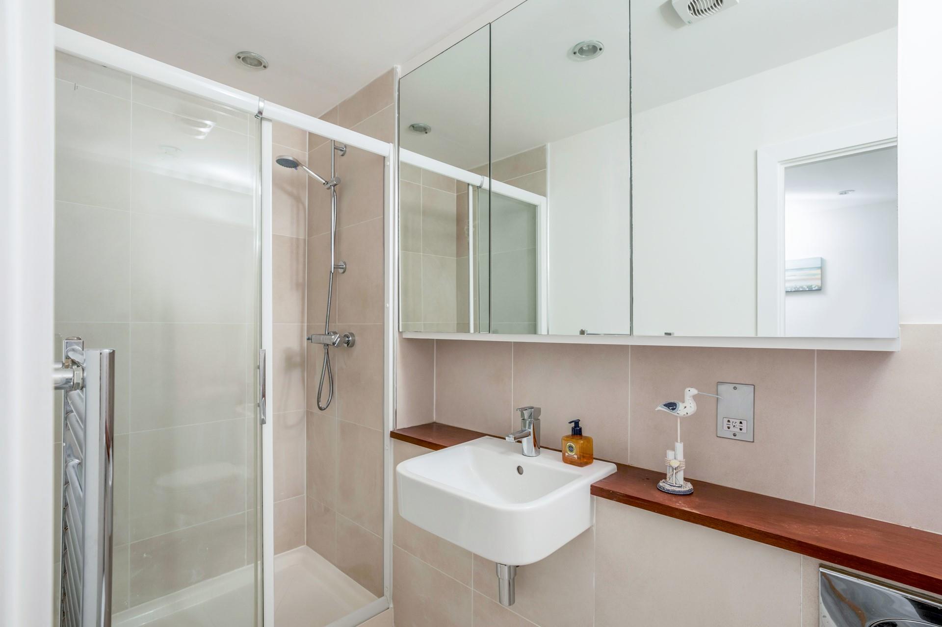 Wash off sandy toes in the shower after a day on the sand.