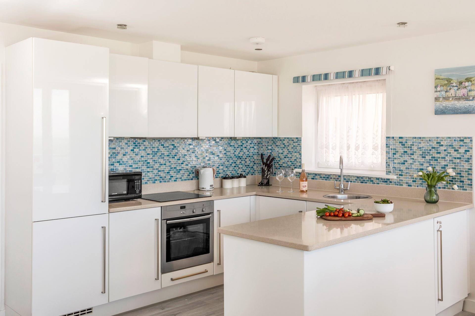 Rustle up a picnic and take it down to enjoy on Porth Beach.