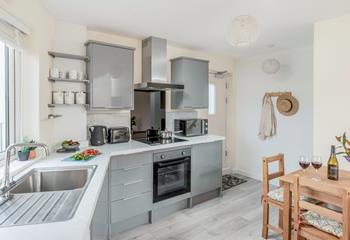 The kitchen is well-equipped for preparing and cooking meals.