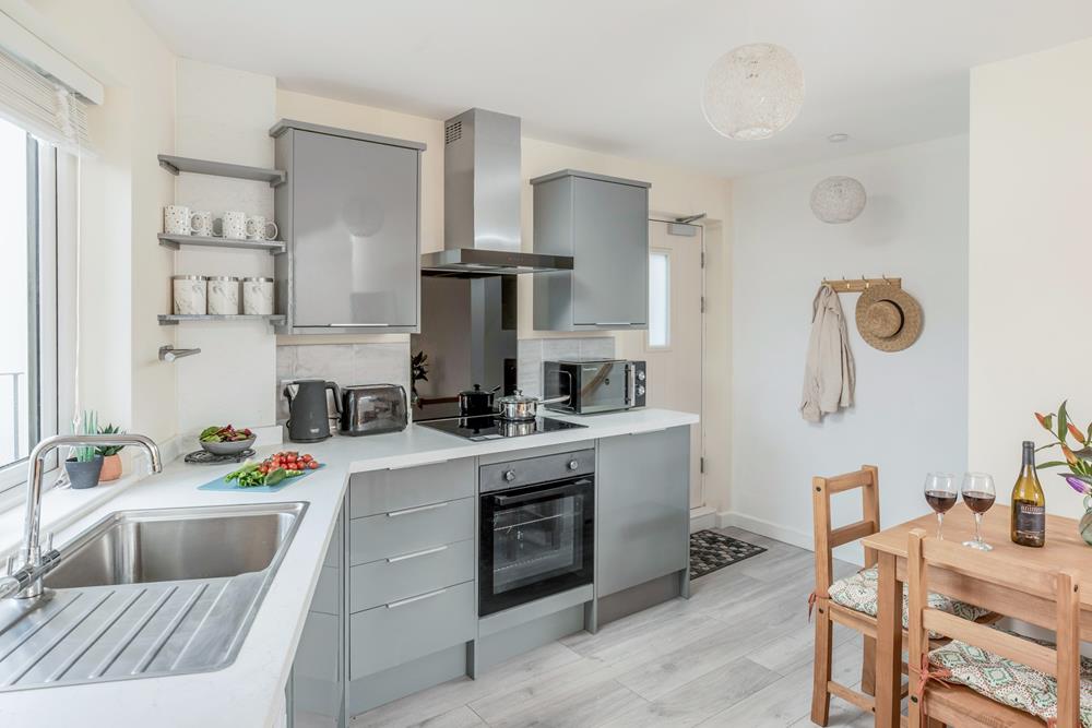 The kitchen is well-equipped for preparing and cooking meals.