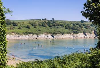 Maenporth is a sheltered cove perfect for paddleboarding or swimming.