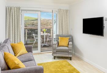 The cosy sitting room is the ideal space to relax after day's on the sand.