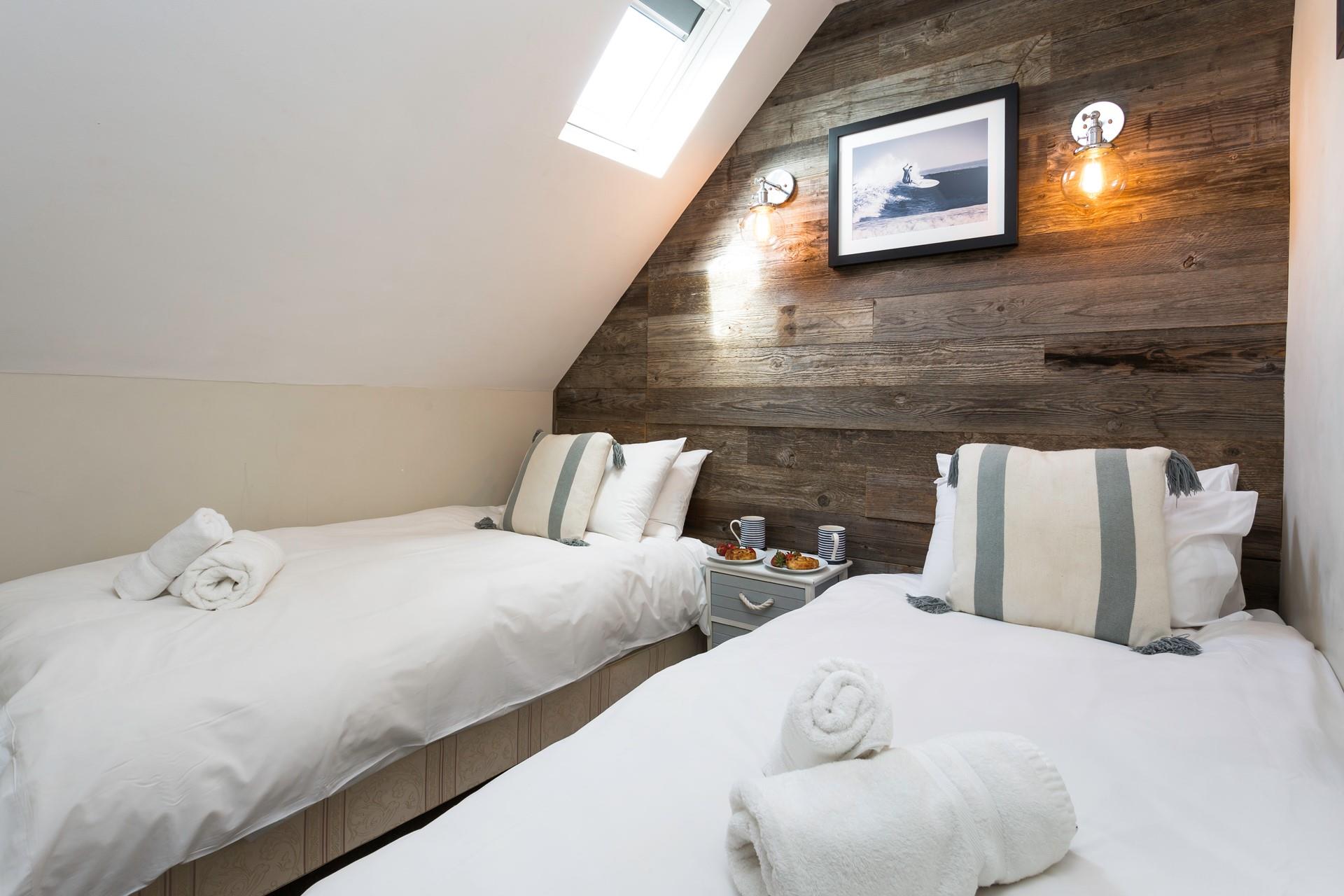 Bedroom 2 has twin beds for a relaxing night's sleep.