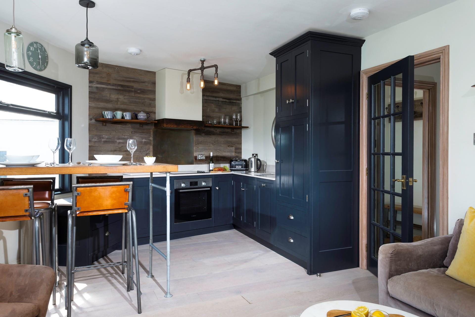 The kitchen is modern and stylish.