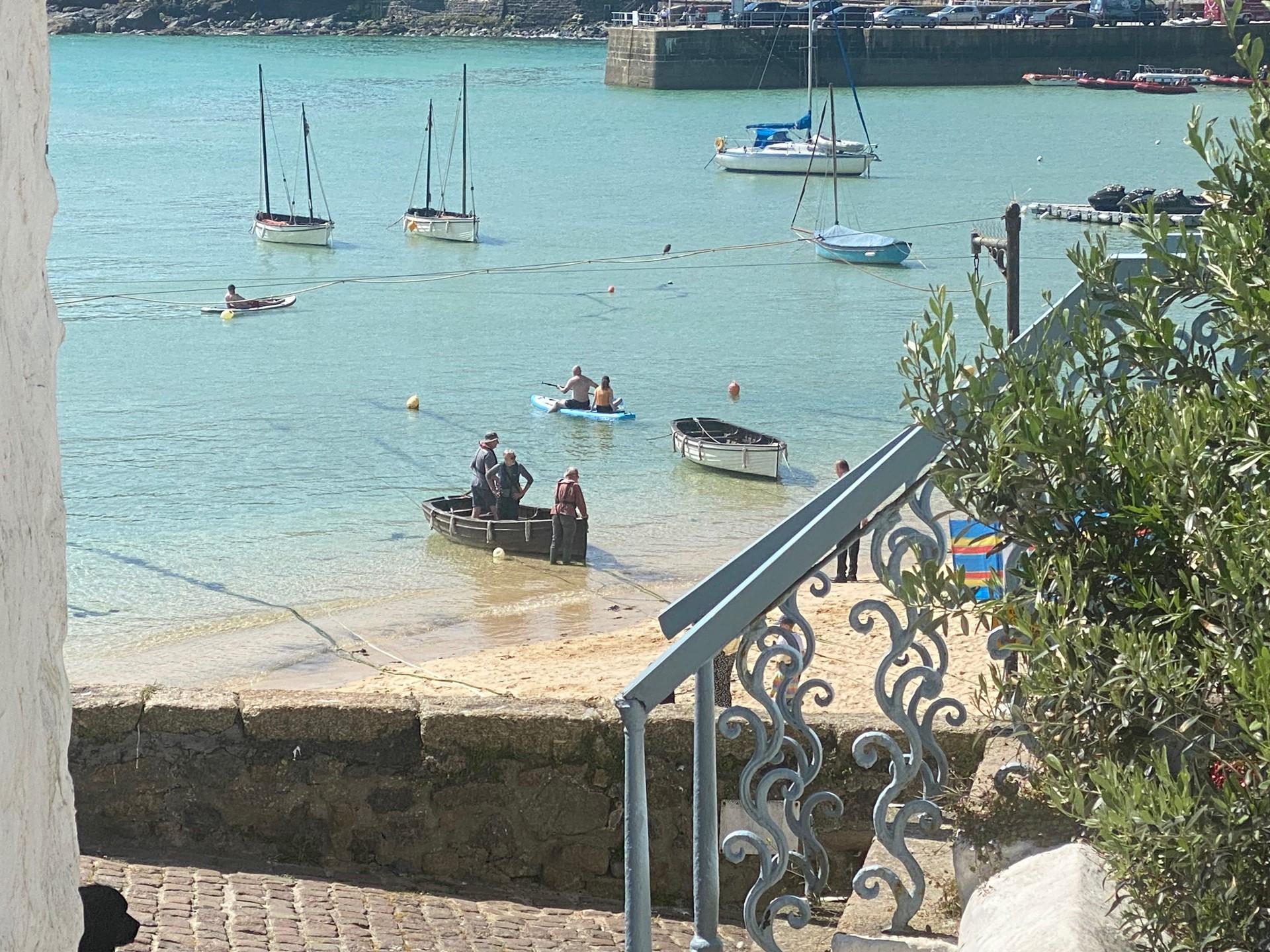 Take a morning dip or paddleboard in the turquoise waters.