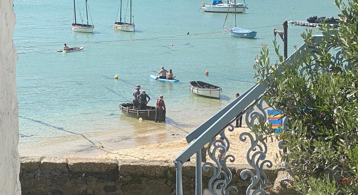 Take a morning dip or paddleboard in the turquoise waters.