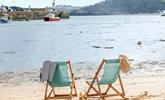 Sit on the beach in a deckchair in the summer sun. - Thumbnail Image