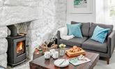 The sitting room is cosy, perfect for nights in front of the fire. - Thumbnail Image