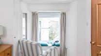 Relax in the armchair with a cuppa.