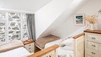 The twin beds are ideal for young adults or children.