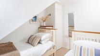 The bedrooms are simply decorated with calming tones.