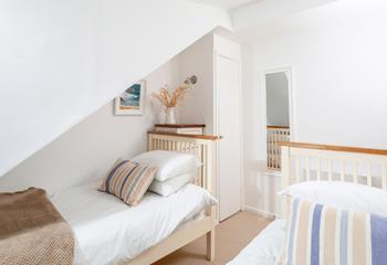 The bedrooms are simply decorated with calming tones.