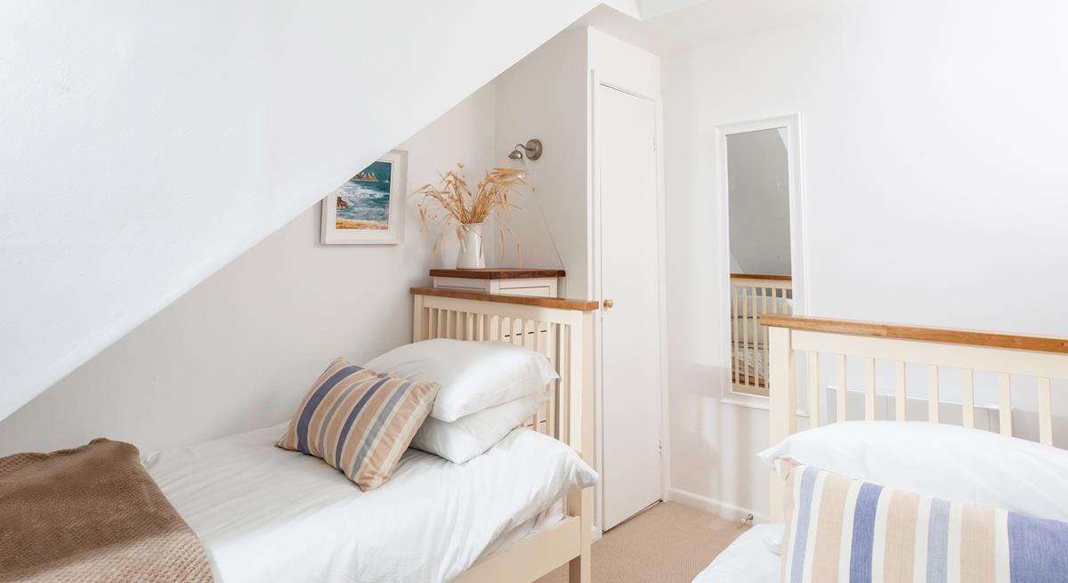 The bedrooms are simply decorated with calming tones.