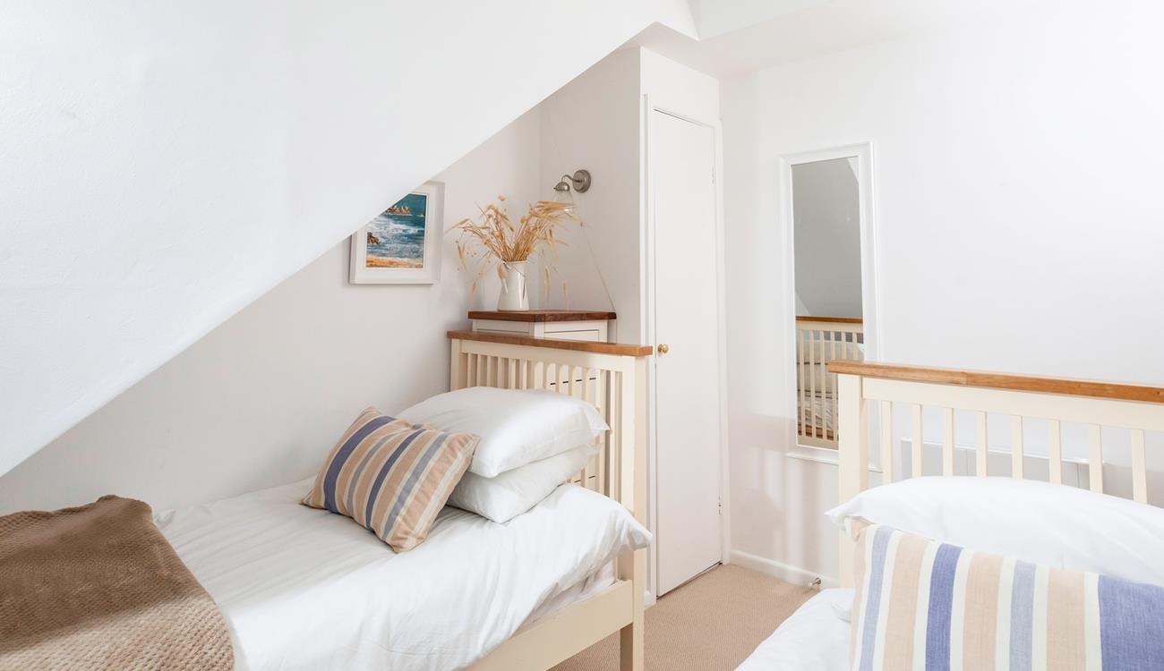 The bedrooms are simply decorated with calming tones.