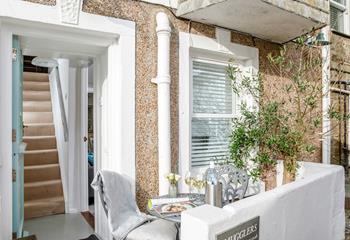 Watch the world go by in the courtyard.