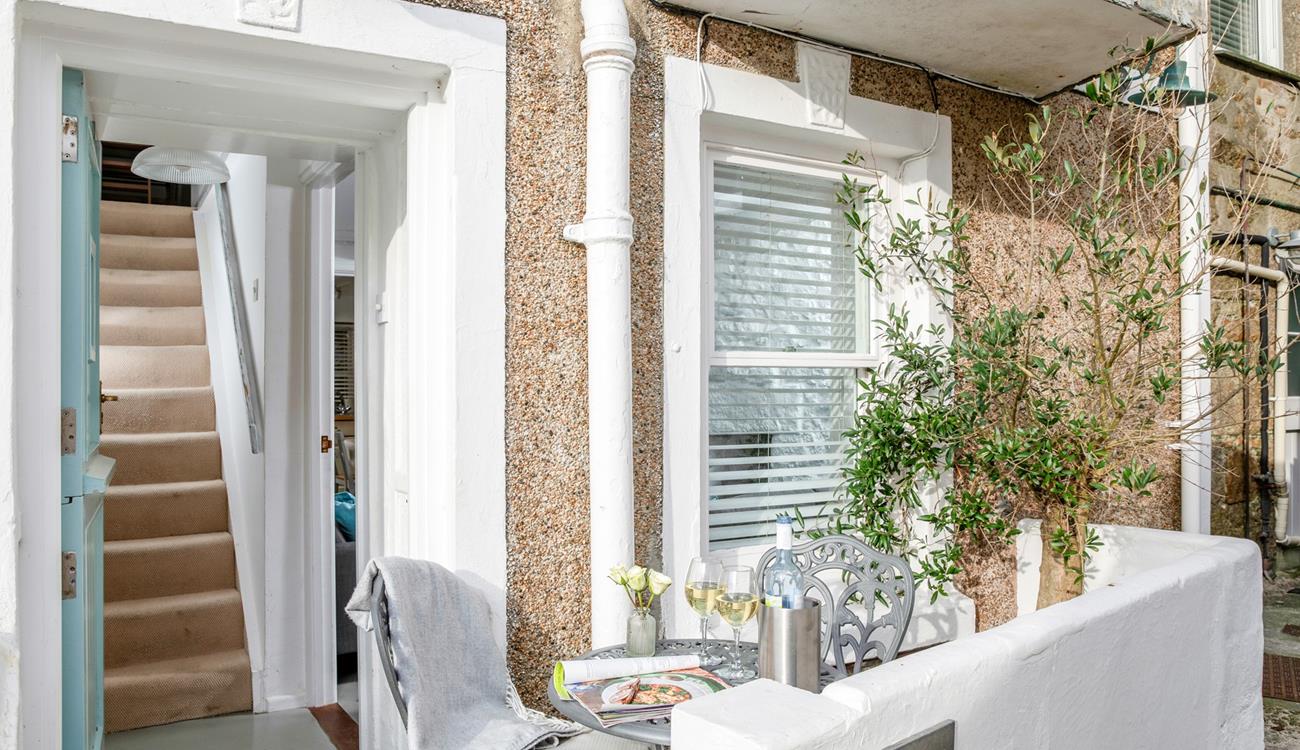 Watch the world go by in the courtyard.