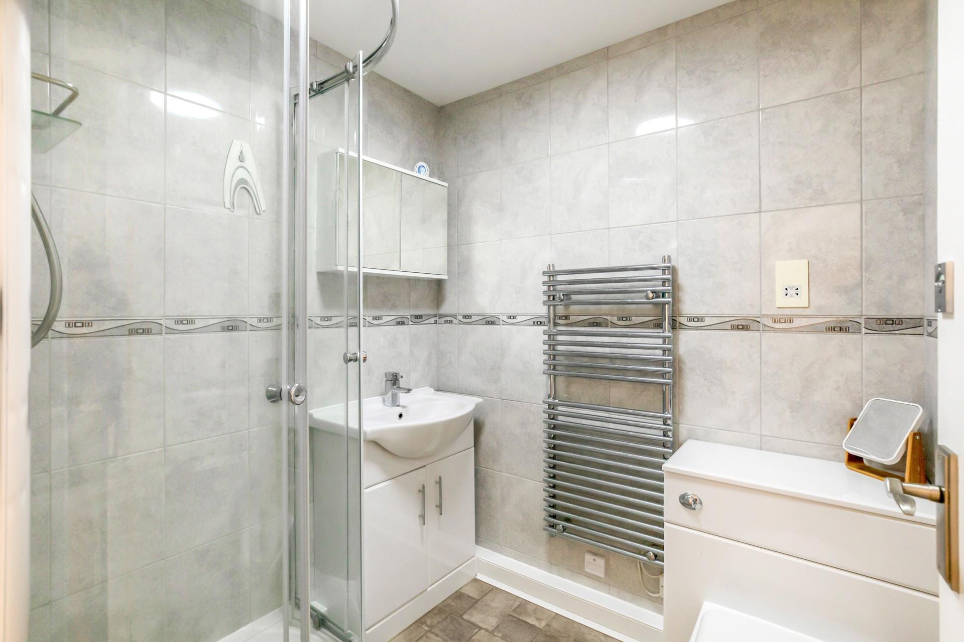 Wash off sandy toes in the shower after a day on the beach.