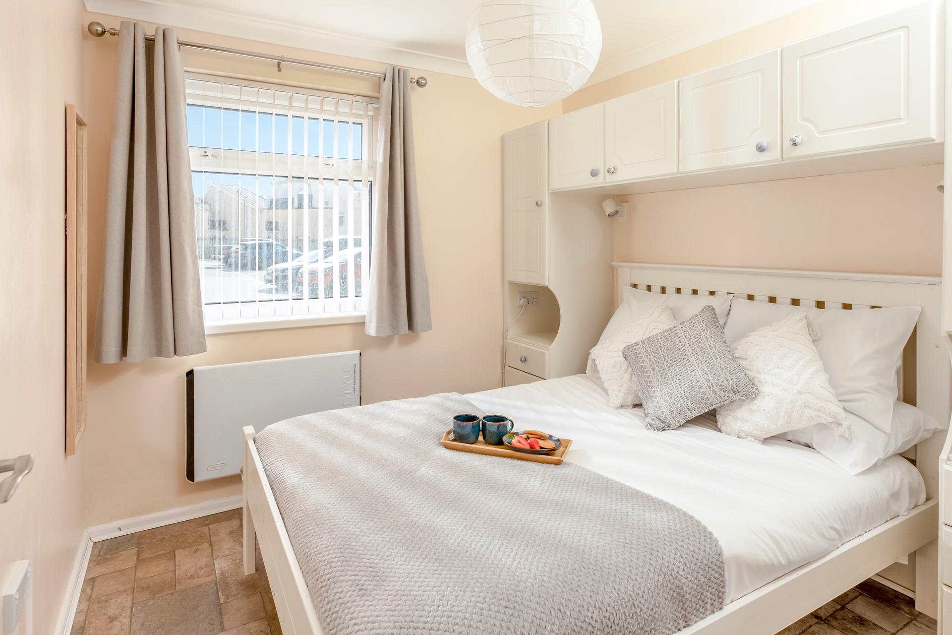 Tuck into the spacious bed each night and drift off to sleep.