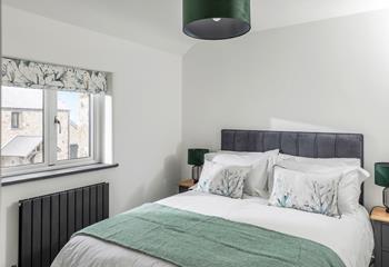 We love the stylish seaside greens in the bedroom!