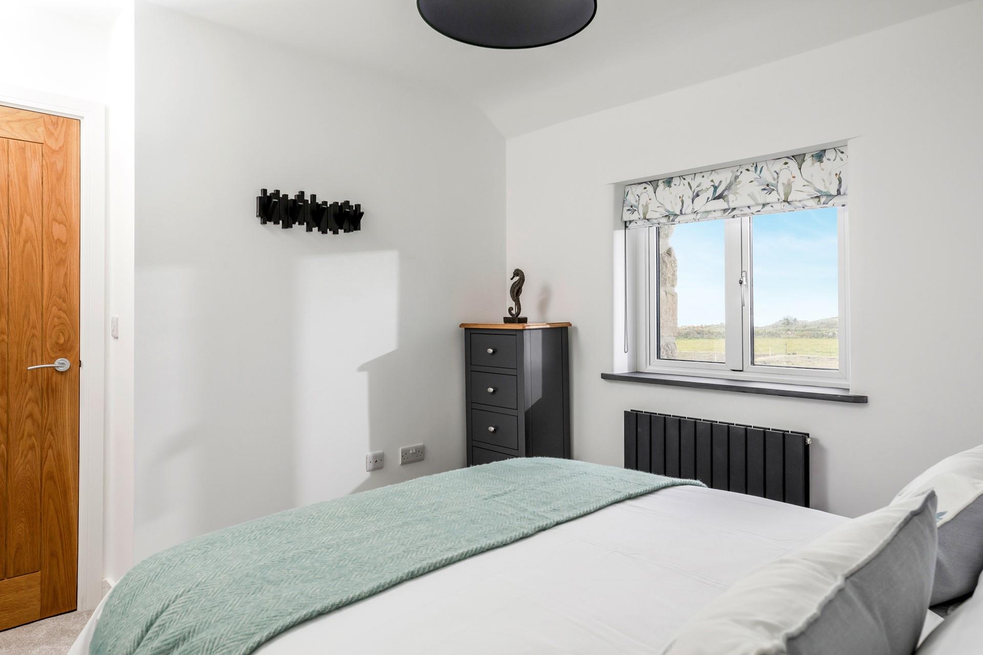 Wake up to countryside and sea views each morning.