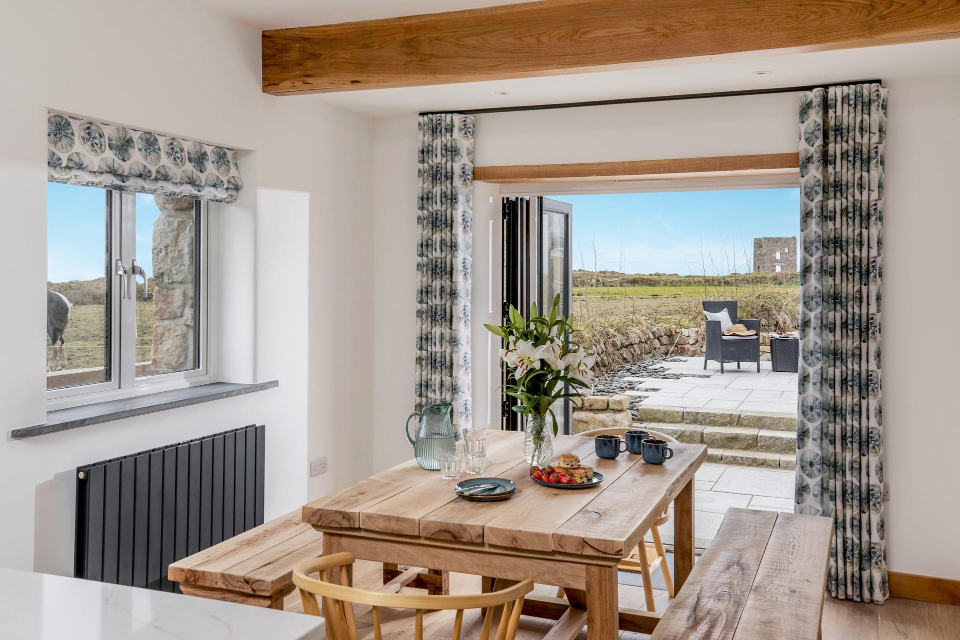 Gather around the dining table to enjoy a hearty meal with a view.