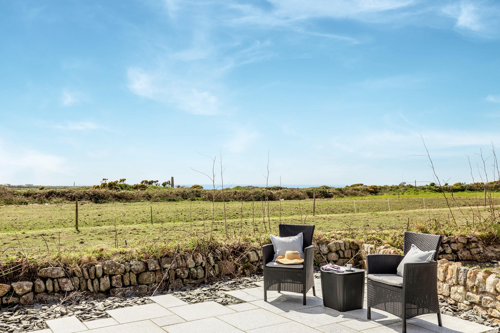 Sip a cuppa with countryside and sea views.