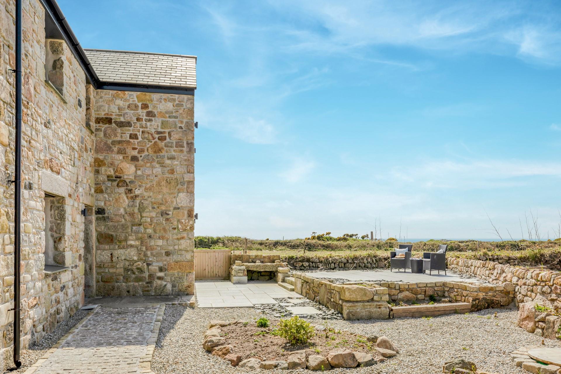 The patio area is perfect for enjoying al fresco nights with family or friends.