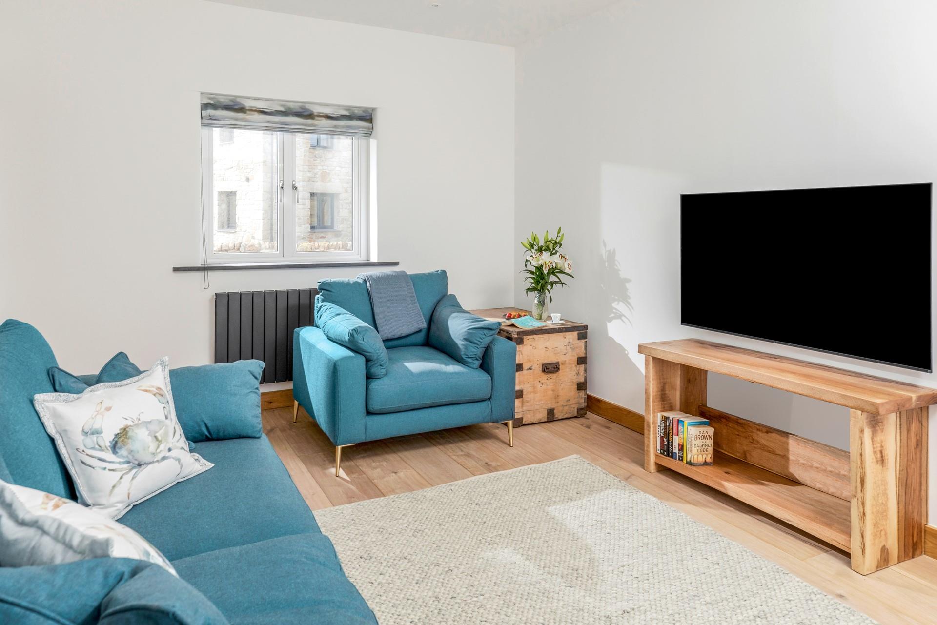 The sitting room is the ideal space to gather the family around for a film night.