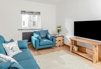 The sitting room is the ideal space to gather the family around for a film night.